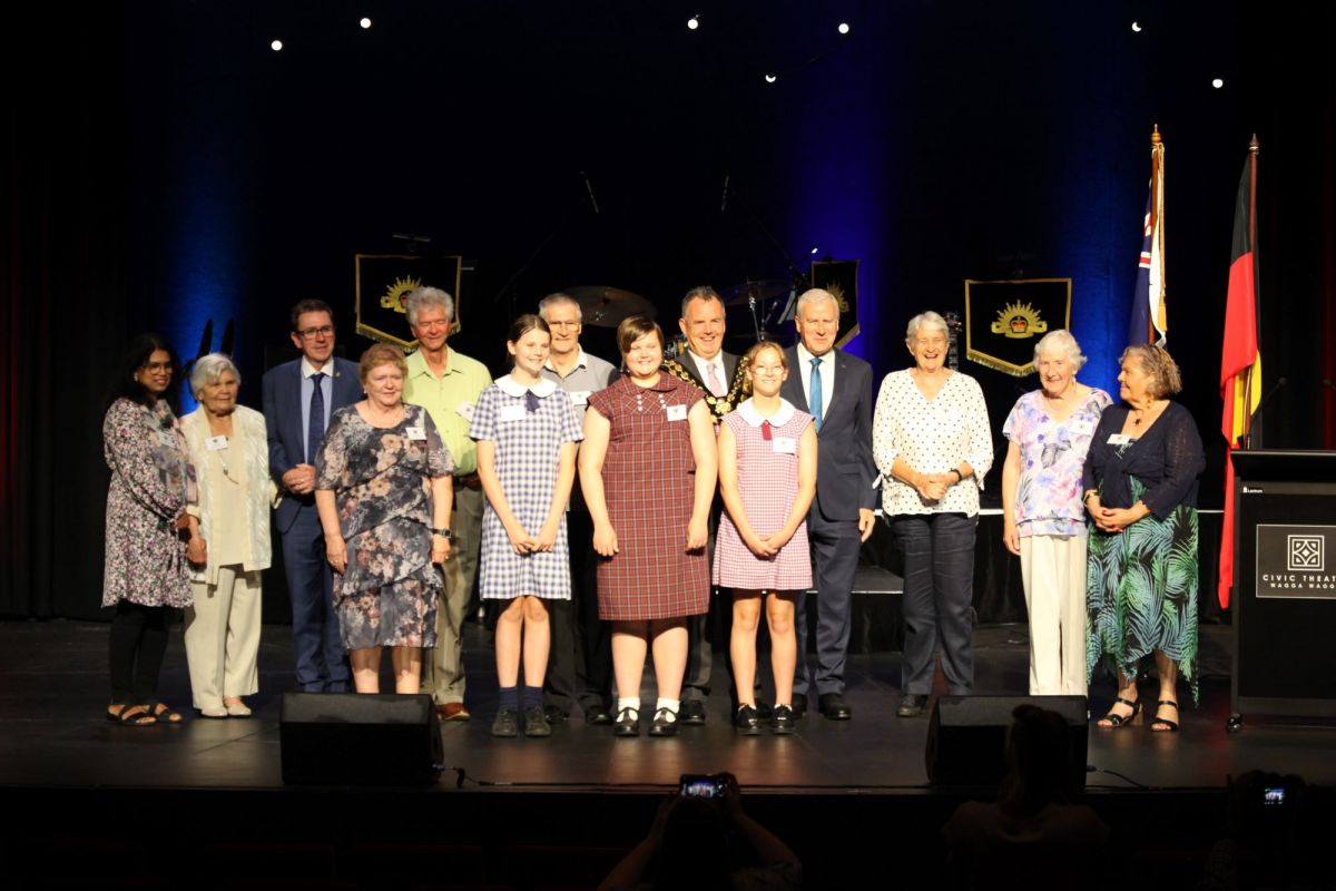 2023 Australia Day Awards ceremony officials and recipients on stage 
